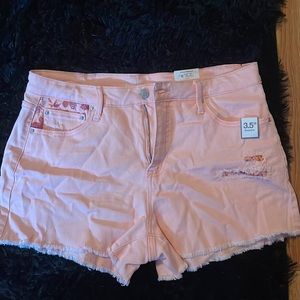 Pink denim shorts with floral pockets size 12 women’s